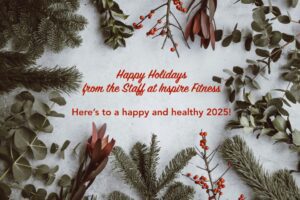 Festive holiday message with evergreen branches.