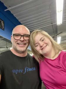 A couple smile with looking ahead